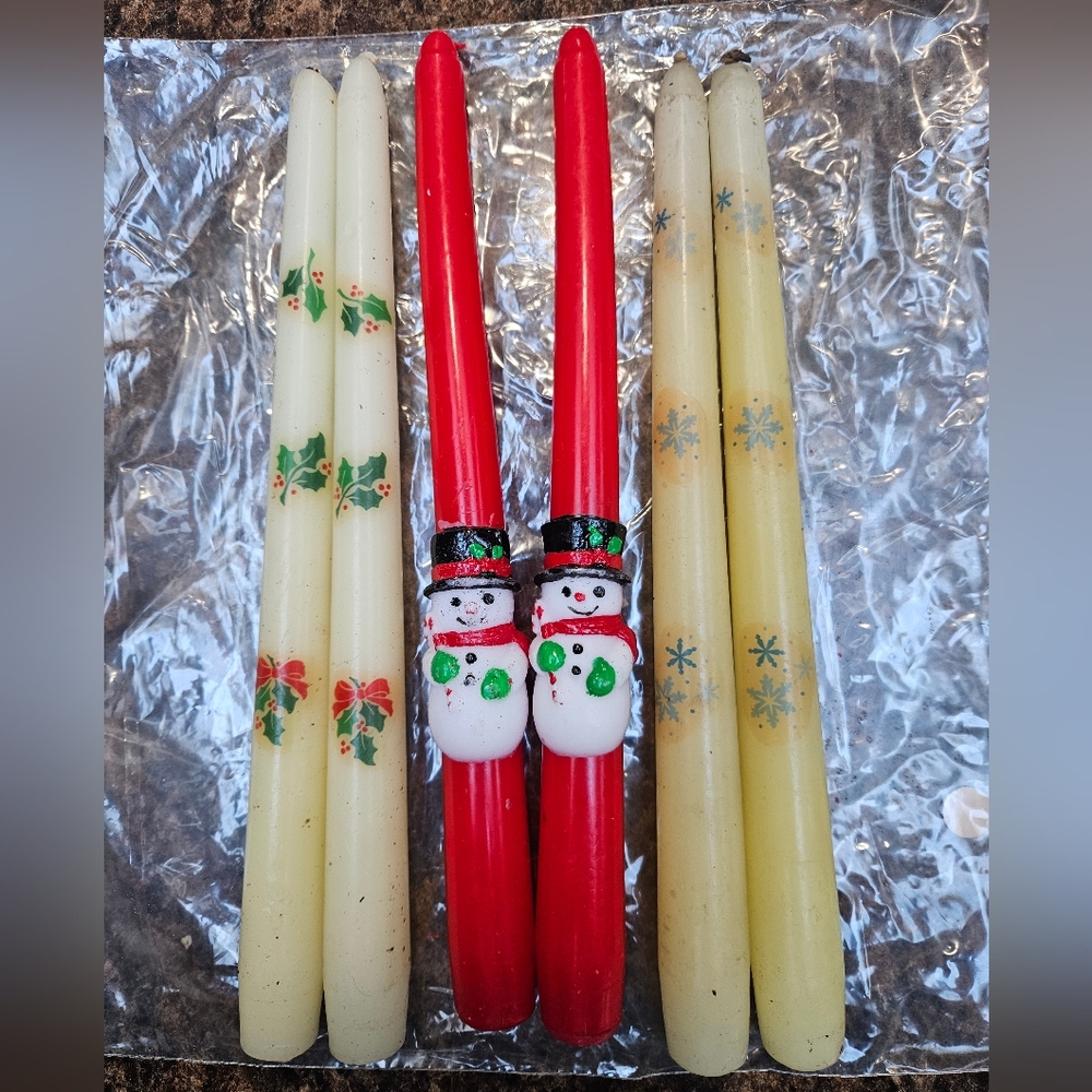 Vintage candles , 2 have been used slightly, and the snowflake set is yellowed.